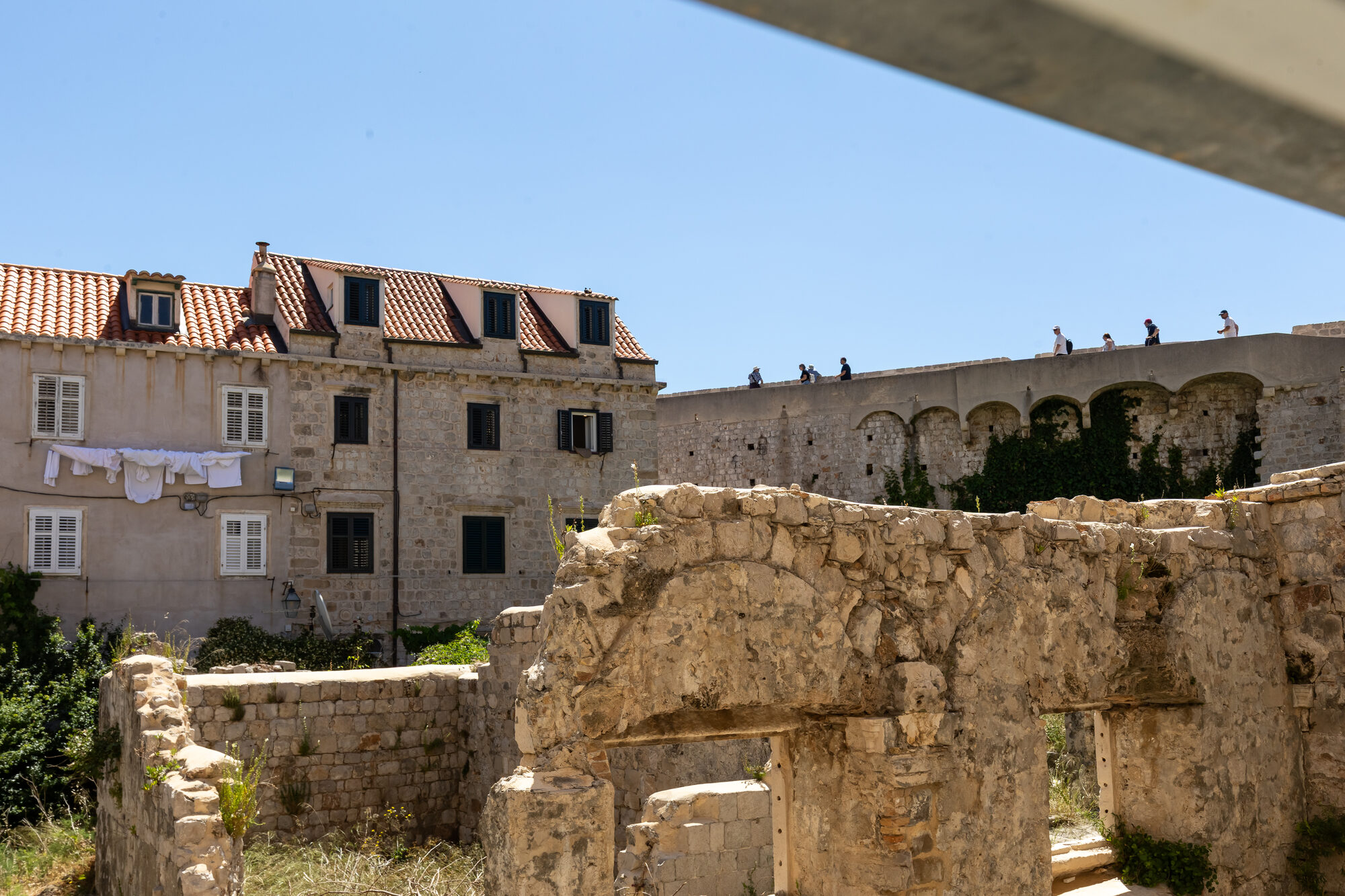View of medieval stone ruins and Dubrovnik's outer city wall